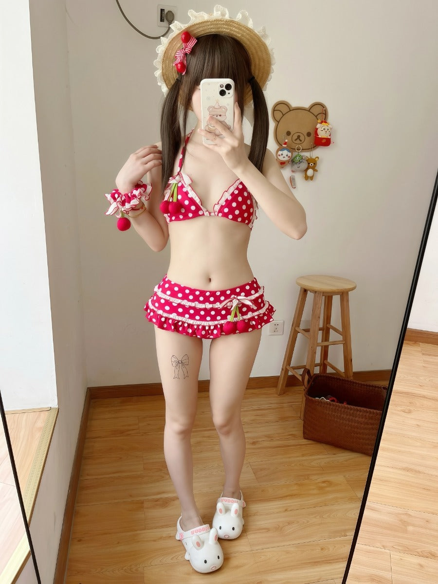 Person wearing a red polka dot bikini with cartoon character design in a room.