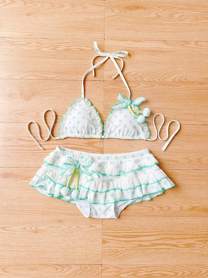 Two-piece swimsuit with ruffled design on a wooden floor