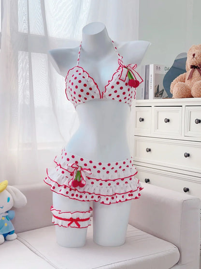 Mannequin wearing a red and white polka dot bikini with ruffles in a room setting.