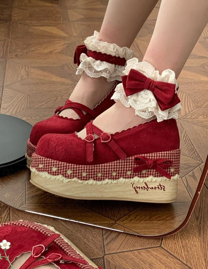 Cottagecore Red platform shoes with white lace and bows on a wooden floor.