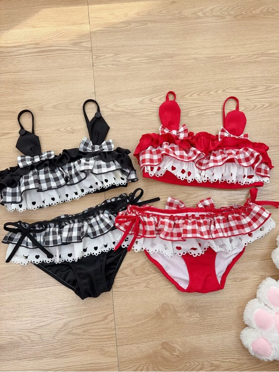 Red and black checkered bikini set on a wooden floor