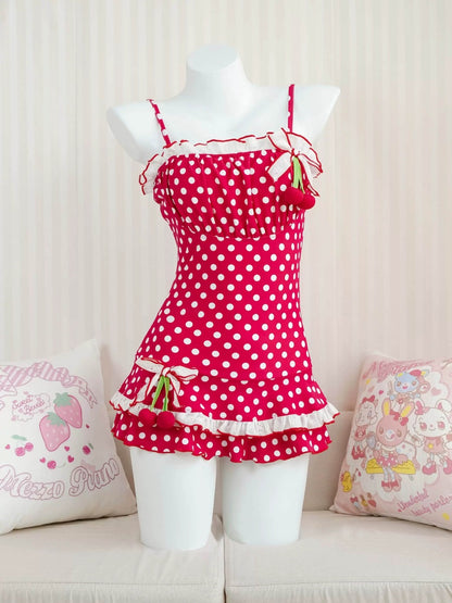 Red polka dot dress on a mannequin with a light background