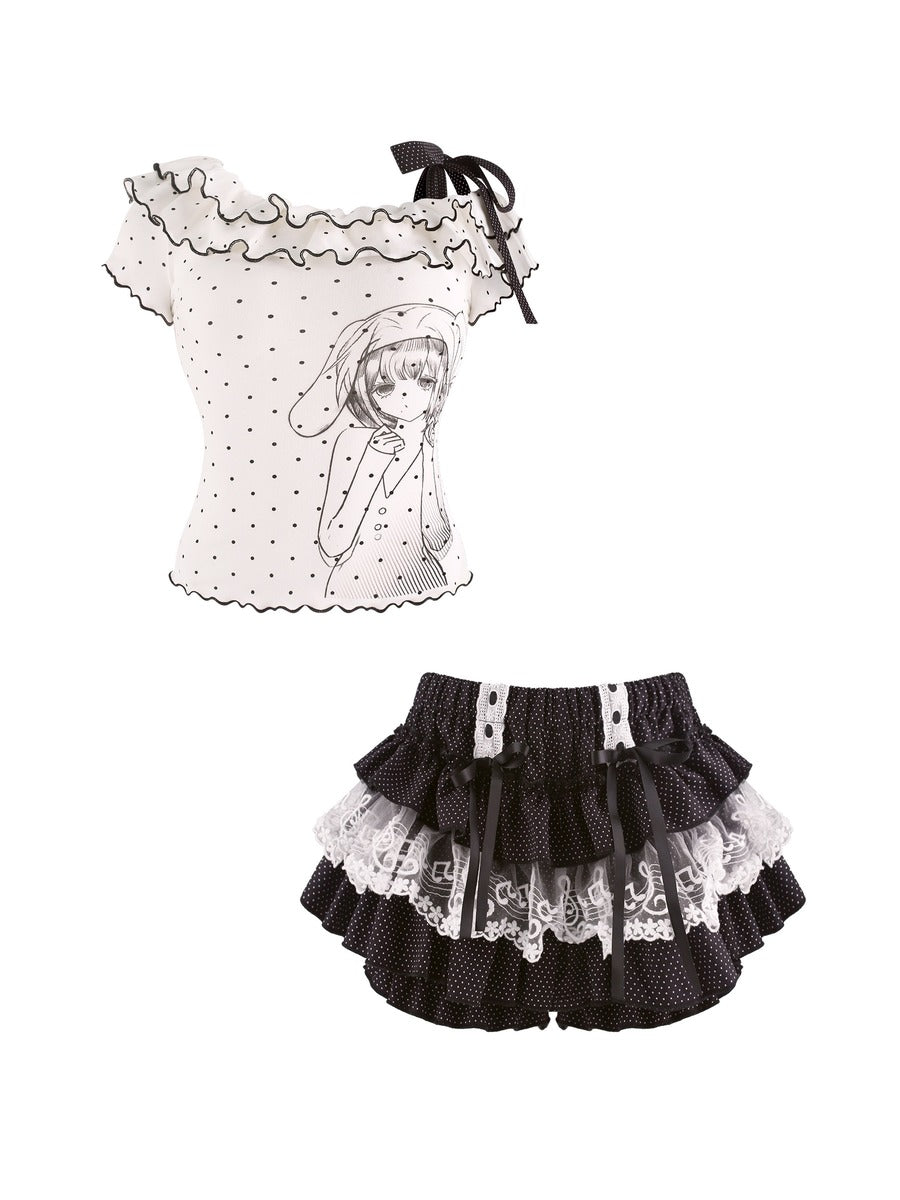 Children's outfit with polka dot top and black skirt on a white background