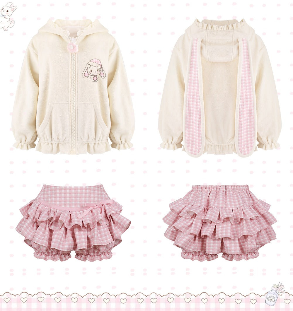 A three-piece outfit set featuring a cream-colored zip-up hoodie with bunny ears and a pink gingham checkered scarf, paired with matching pink gingham ruffled bloomers shown in front and back views.