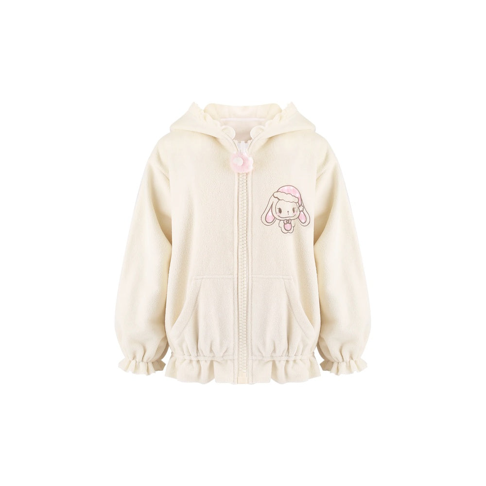 A cream-colored zip-up hoodie for girls, featuring a cute pink cartoon bunny character on the left chest, a pink pom-pom zipper pull, and ruffled trim along the hood, cuffs, and hem.