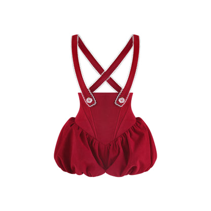 Red romper with suspenders on a white background