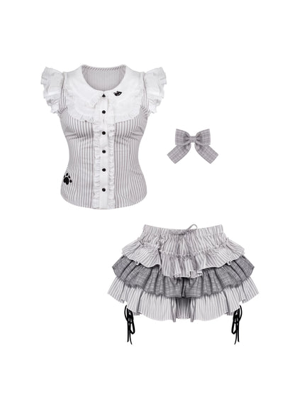 Lolita fashion outfit with top, skirt, and headband on a white background