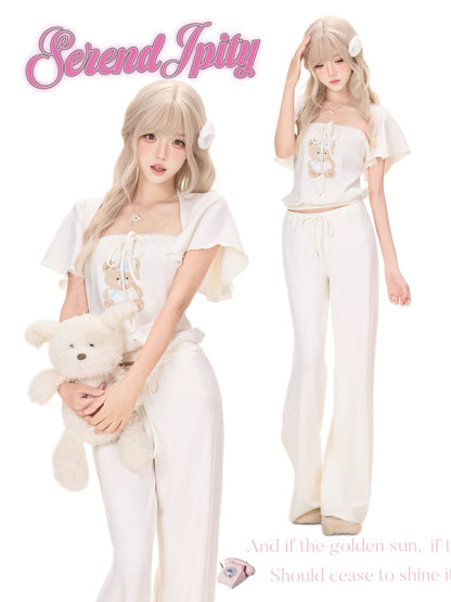 A fashion listing image showing a blonde model in a cream and white two-piece outfit with a teddy bear, alongside a smaller back view of the same outfit.