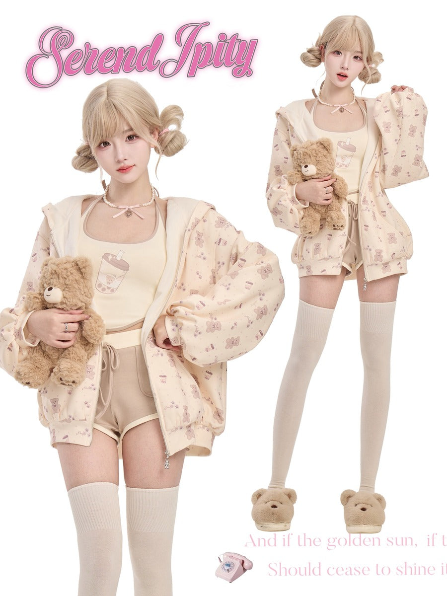 Two people wearing matching pastel outfits with teddy bears