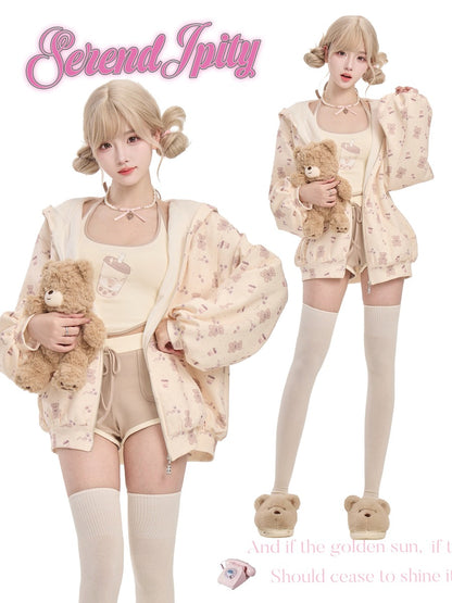 Two people wearing matching pastel outfits with teddy bears
