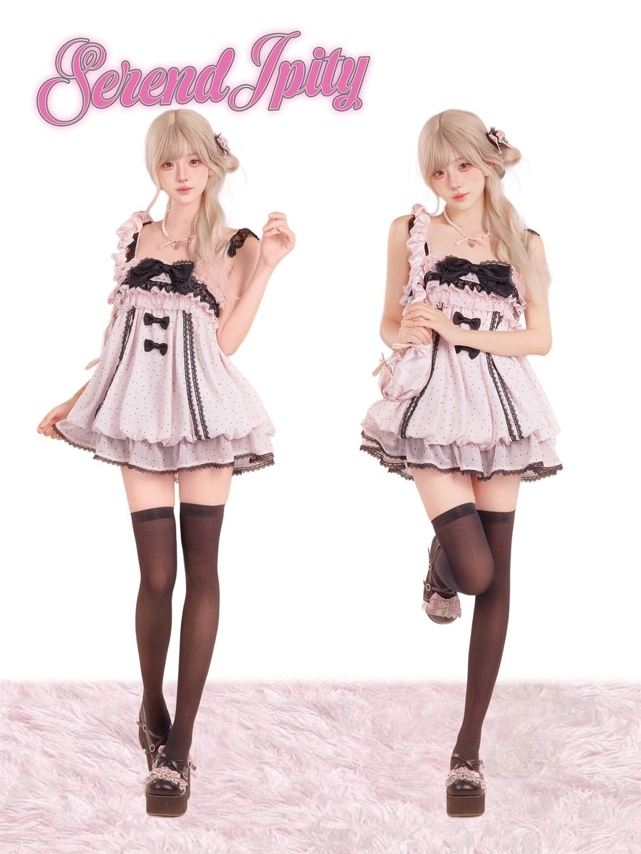 Two views of a model wearing a pink and white ruffled Lolita dress with black trim, black thigh-high stockings, and brown platform shoes.