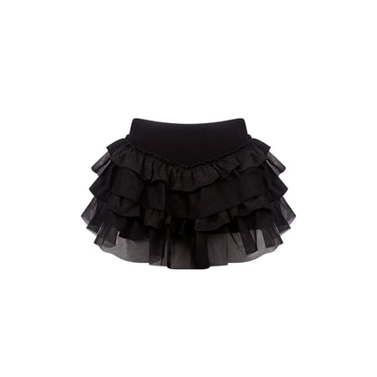 A black ruffled tutu skirt with multiple tiers of sheer mesh and fabric layers, shown against a plain white background.