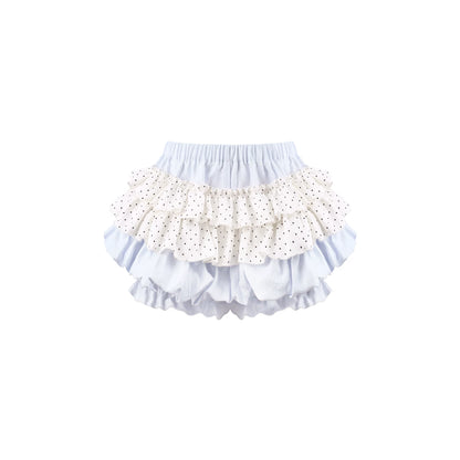 A pair of ruffled bloomers featuring a light blue base with a white ruffle printed with tiny black polka dots, set against a plain white background.