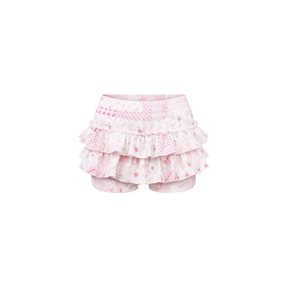 Pink ruffled bloomers with floral pattern on a white background