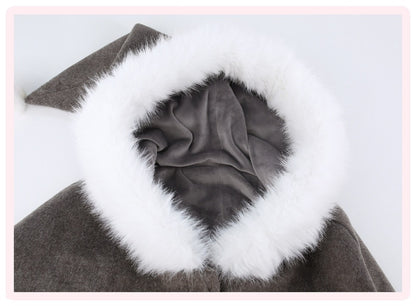 Close-up of a dark brown coat or dress with a large white faux-fur trimmed collar and a gray fabric lining visible inside the opening.