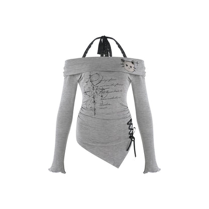 A light gray long-sleeve top with a unique asymmetrical wrap design, featuring black lace-up details on the side, a black braided strap at the neckline, and a small cat face graphic on the upper right shoulder.