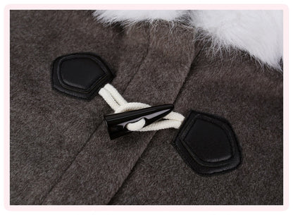 Close-up of a dark brown wool-like coat with black toggle closures, white rope, and a white faux-fur trim at the collar.