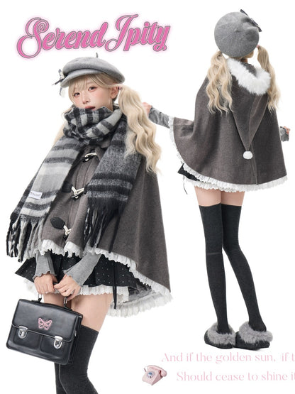 A fashion collage showing a model from the front and back wearing a gray and black striped toggle poncho with white fringed trim, a matching gray beret, a thick gray plaid scarf, black thigh-high socks, and gray slippers. The brand name 'Serendipity' is written in pink at the top left.