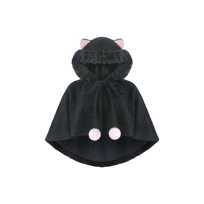 A black plush hooded cape with pink cat ears on the hood and two pink pom-poms on the front, shown against a plain white background.