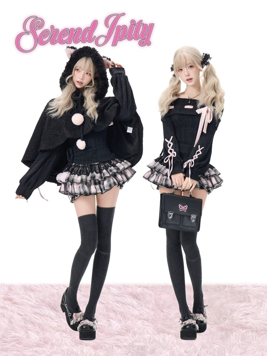 Two models posing in matching black and pink Lolita-style outfits with plaid pleated skirts, thigh-high socks, and platform shoes, with the brand name 'Serendipity' in pink script at the top left.