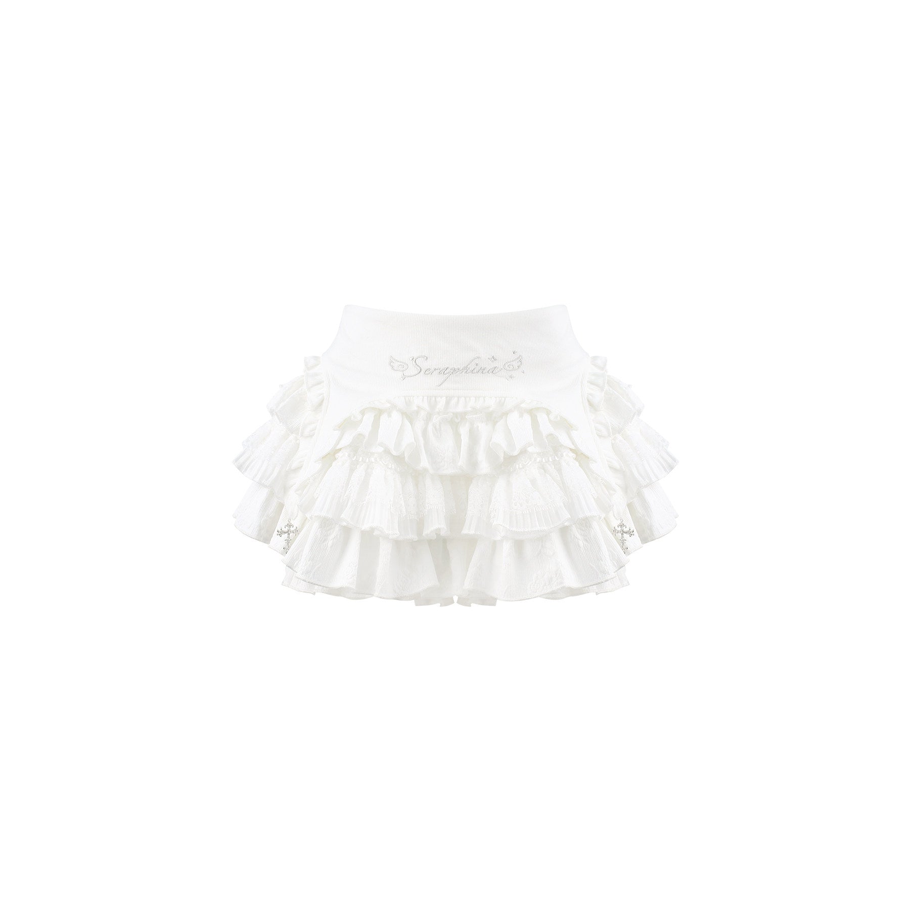 A white ruffled skirt with multiple tiers of delicate fabric and small embroidered details, shown against a plain white background.
