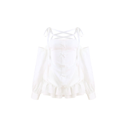 A white long-sleeve cold-shoulder blouse with a lace-up corset-style bodice, ruffled hem, and thin shoulder ties, shown on a plain white background.