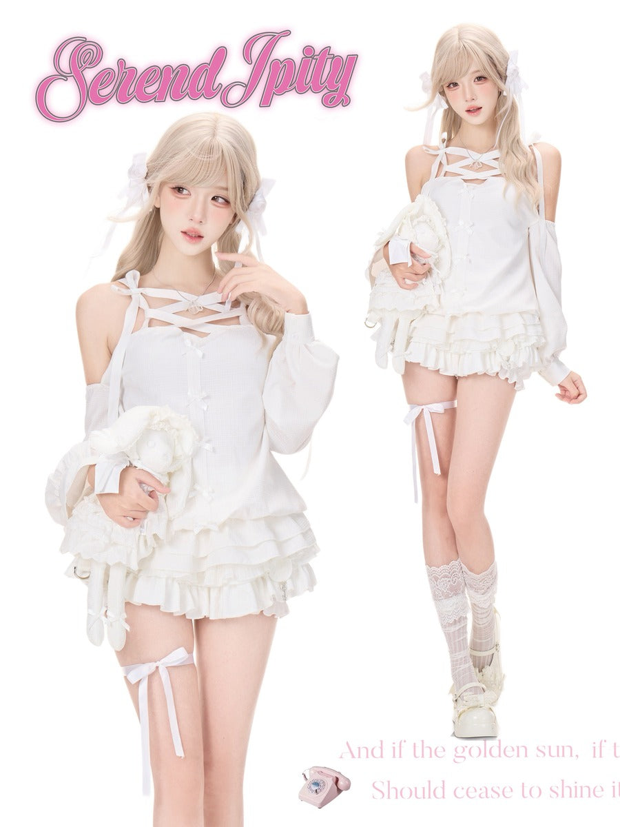 A fashion catalog image featuring a model in two poses wearing a white lolita-style outfit with lace-up halter details, ruffled sleeves, and a matching ruffled mini skirt.