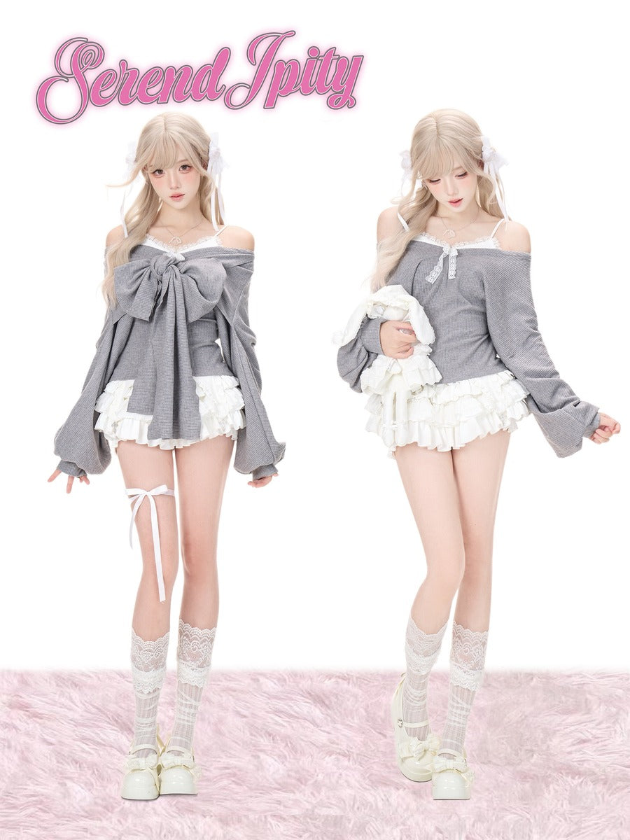 Two anime-style female models wearing matching gray and white lolita outfits, featuring off-the-shoulder long-sleeve tops with large bows, ruffled mini skirts, lace knee socks, and white shoes.