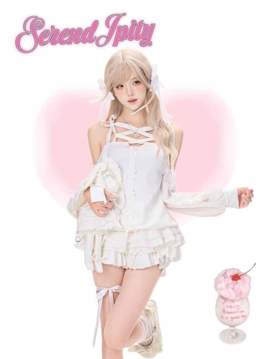 A young woman models a white frilly halter dress with lace-up details, styled with a matching white jacket and white thigh-high stockings. She is posed against a white background with a soft pink heart graphic