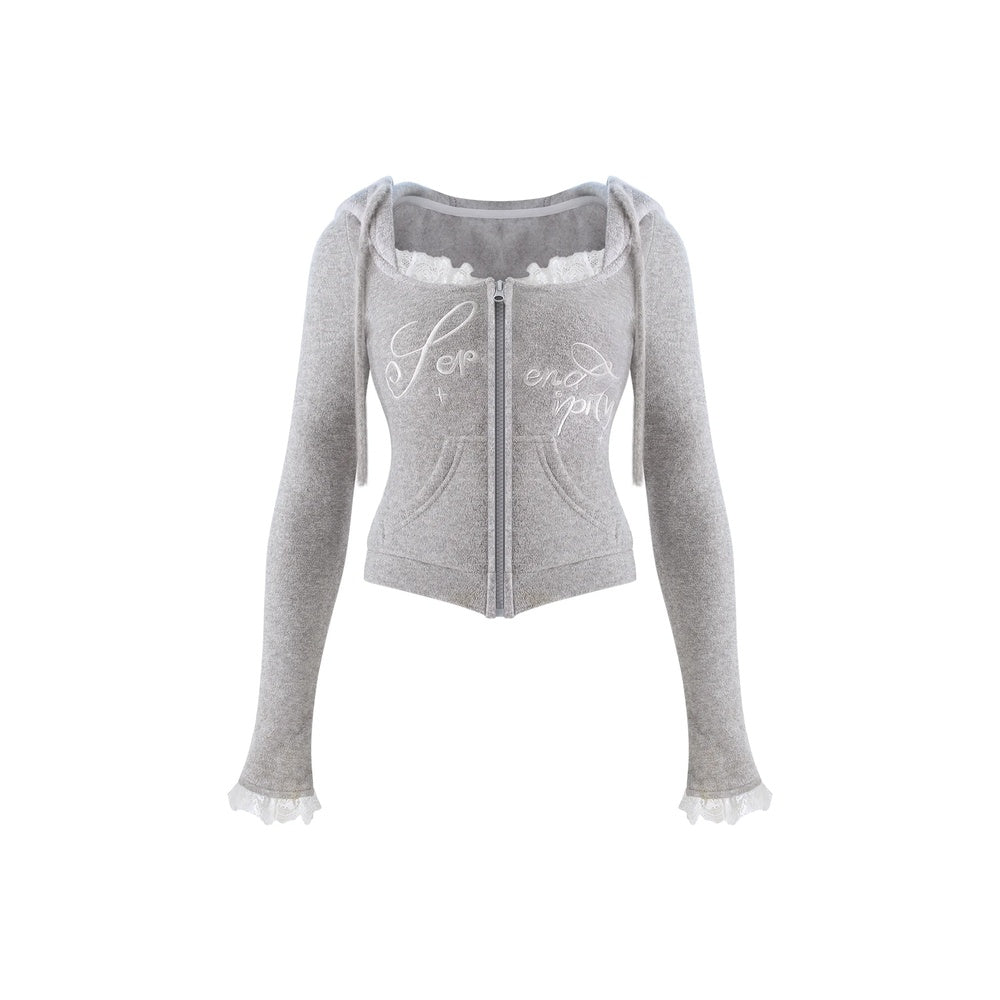 A light gray cropped zip-up hoodie with long sleeves, ruffled trim at the neckline and cuffs, and white script text on the front, shown against a plain white background.