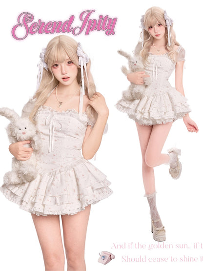 Person in a white lace outfit holding a plush toy