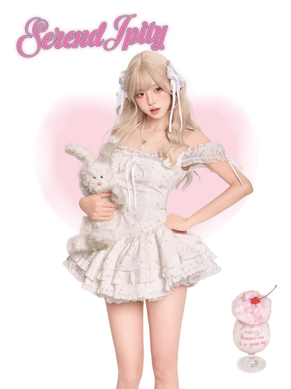 Person in a white lace outfit holding a plush toy
