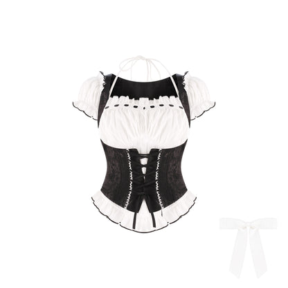 Black and white corset with puffed sleeves on a white background