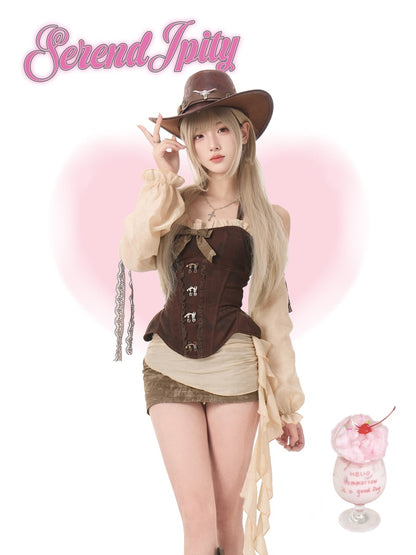 Person in a cowboy outfit and dessert in the background