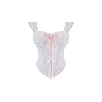 A white ruffled lingerie bodysuit with a pink satin bow at the sweetheart neckline and a matching pink ribbon tie at the center front, shown against a plain white background.