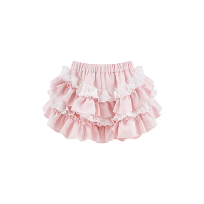 A light pink tiered ruffle skirt with white lace trim, photographed flat against a solid white background.
