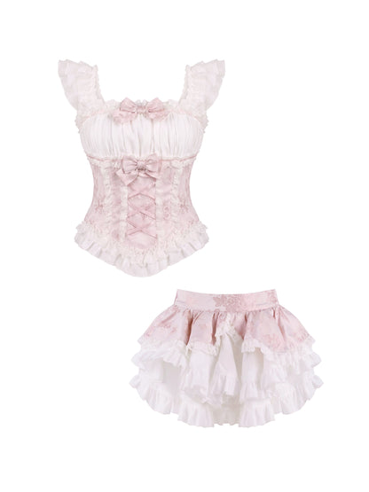 Set of pink and white ruffled top and skirt on a white background
