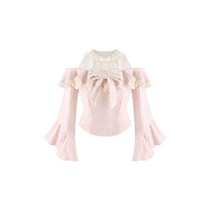A pale pink off-the-shoulder long-sleeve blouse with cream lace trim, a large bow at the neckline, and ruffled bell-shaped sleeves, shown on a plain white background.
