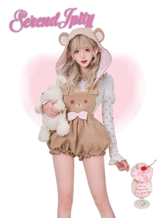 Person wearing a cute outfit with bear ears and a bow, holding a plush toy, on a white background