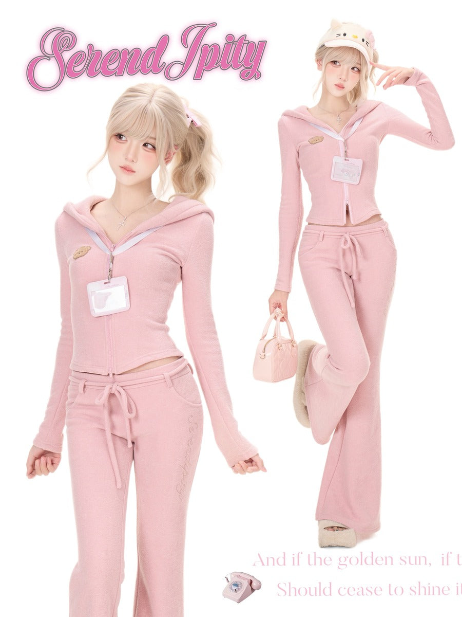 A pink two-piece lounge set modeled in two poses on a white background, featuring a zip-up hoodie and matching drawstring sweatpants.