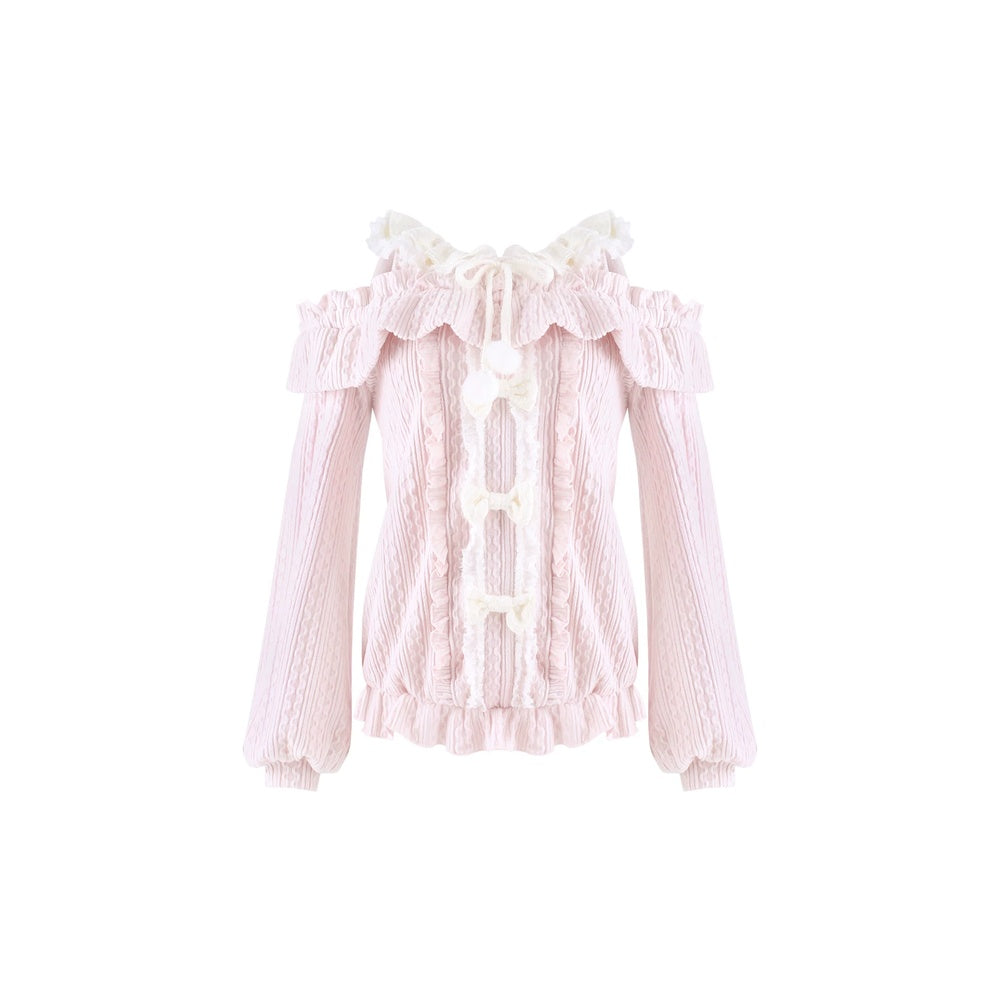 A light pink long-sleeve blouse with a textured knit body, ruffled collar, and white lace-up front details, shown against a plain white background.