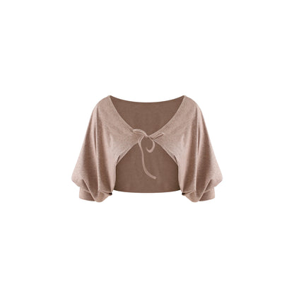 A light brown knit shrug or bolero with a scoop neckline, wide draped sleeves, and a front tie detail, shown against a plain white background.