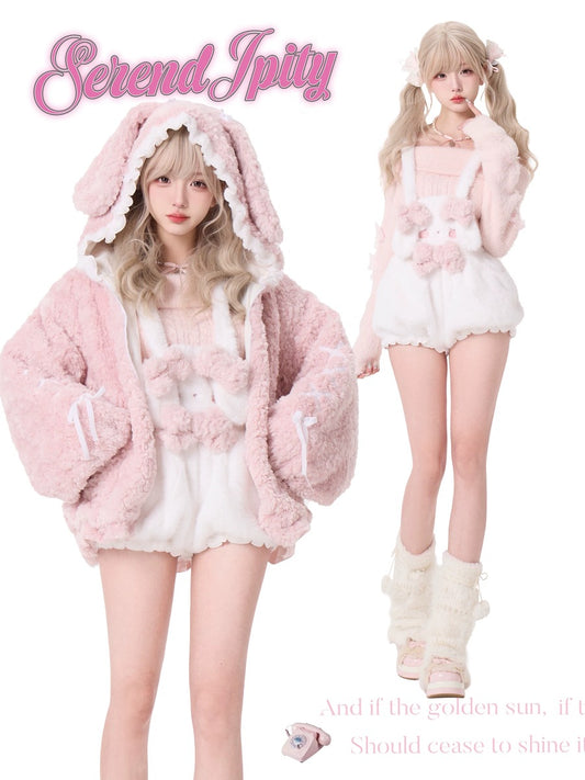 Two people wearing pink and white outfits with fluffy textures