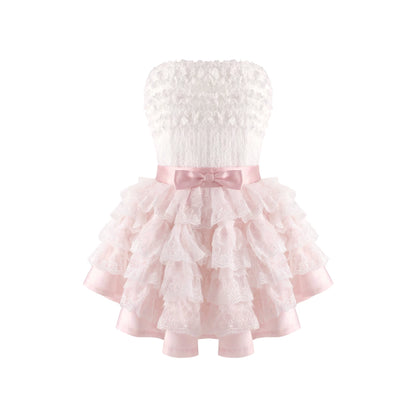 White lace dress with a pink ribbon on a white background