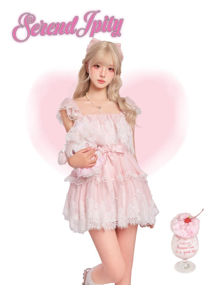 Person wearing a pink lace dress holding a plush toy