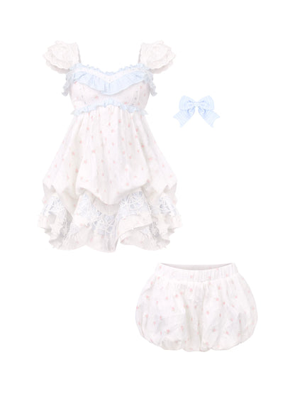 White baby outfit with blue accents on a white background