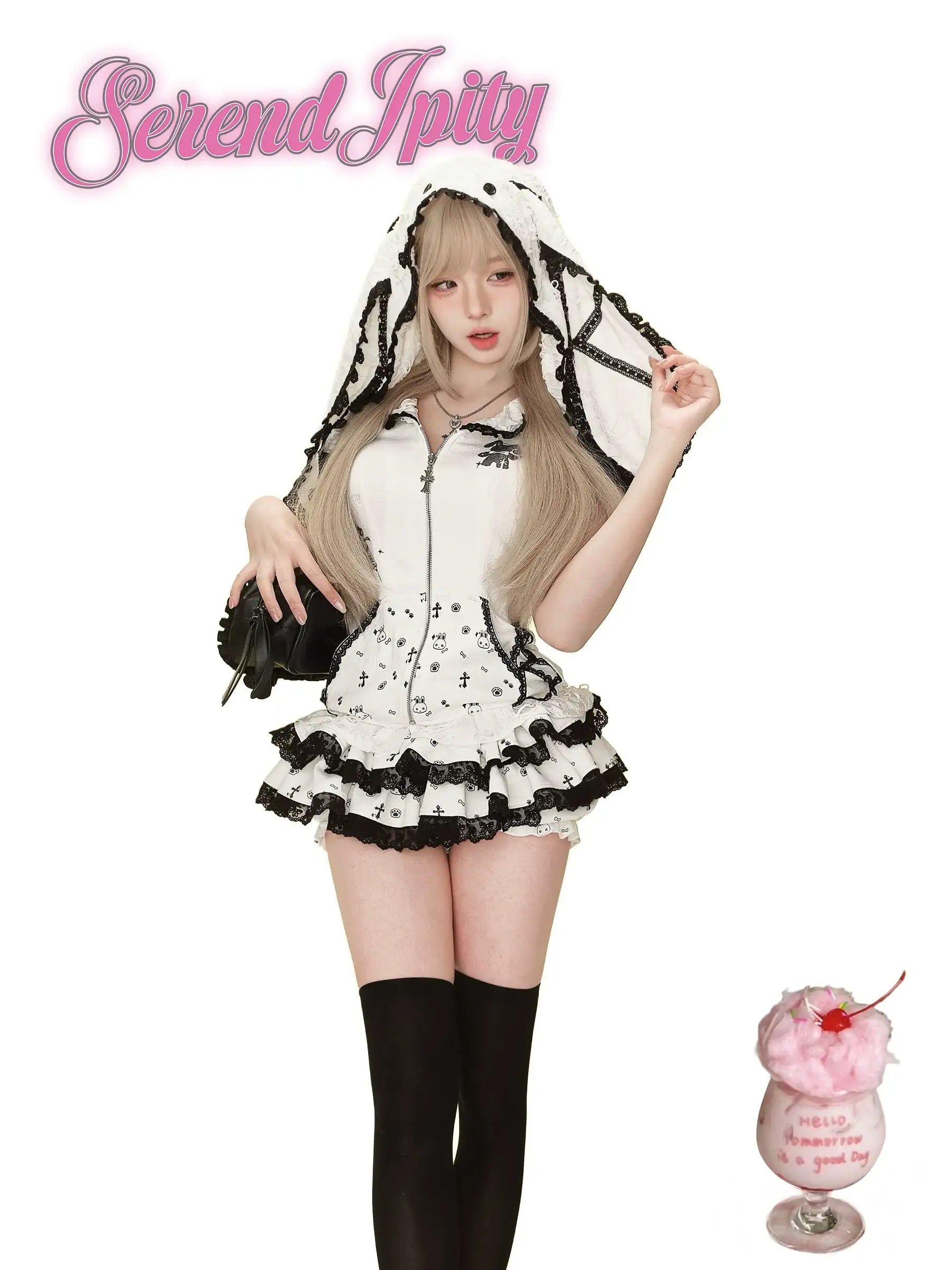 white hoodie with black edges, rabbit ears hood, and matching skirt