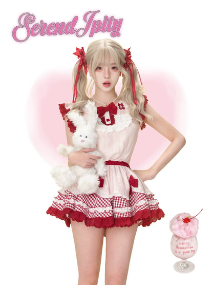 red and pink strawberry-print dress with puff sleeves and white bloomers