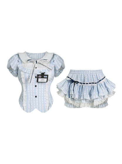 close-up of polka-dot collar top and waistband of skirt