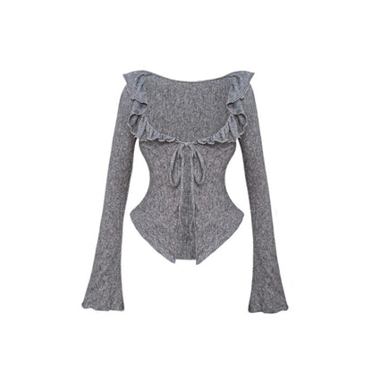 A gray long-sleeve knit top with ruffled shoulder details, a scoop neckline, and a front tie, shown against a plain white background.
